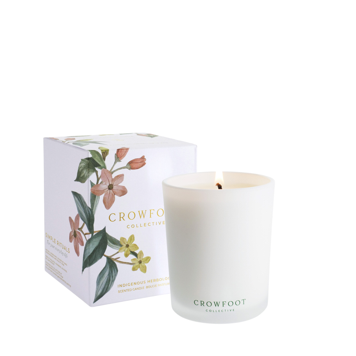 Forest Bathe candle in a frosted white jar beside its botanical illustrated box